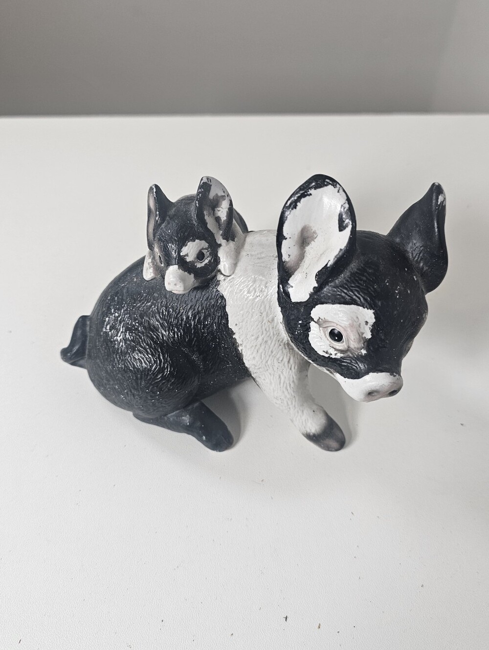 Black and white Mama and baby pig figurine